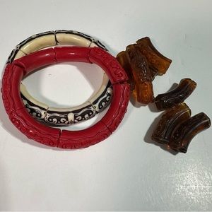 Plastic carved bracelets made to look like coral, and bone